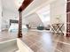 Bedroom featuring wood floors, a bed, and a cozy seating area, view through wooden railing at 262 Orienta Point St # 1, Altamonte Springs, FL 32701