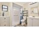 Bright bathroom with white subway tile, a glass-enclosed shower, and vanity storage at 27622 Lois Dr, Tavares, FL 32778