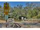 Signage for a Public Boat Ramp on a canal with mature trees at 27622 Lois Dr, Tavares, FL 32778