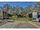 Public boat ramp on a canal with mature trees at 27622 Lois Dr, Tavares, FL 32778