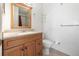 Clean bathroom with wood vanity and shower/tub combo at 306 Loch Low Dr, Sanford, FL 32773