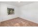 Well-lit bedroom featuring a window and carpeted floor at 306 Loch Low Dr, Sanford, FL 32773