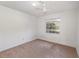 Simple bedroom with ceiling fan and window coverings at 306 Loch Low Dr, Sanford, FL 32773