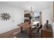 Bright dining area features a stylish table, chandelier, and contemporary decor at 306 Loch Low Dr, Sanford, FL 32773