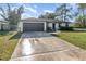 Front view of house with driveway at 306 Loch Low Dr, Sanford, FL 32773