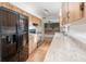 Galley kitchen with wood cabinets and granite countertops at 306 Loch Low Dr, Sanford, FL 32773