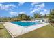 Community pool with surrounding patio and grassy area at 306 Loch Low Dr, Sanford, FL 32773