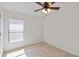 Bedroom with a ceiling fan and large window with blinds at 330 Pheasant Dr, Haines City, FL 33844