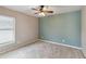 Bedroom with a ceiling fan, light walls, and a window at 330 Pheasant Dr, Haines City, FL 33844