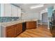 Kitchen featuring granite countertops, wood cabinets, and stainless steel appliances at 330 Pheasant Dr, Haines City, FL 33844