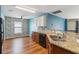 Kitchen area featuring granite countertops, a stainless steel sink and a breakfast bar at 330 Pheasant Dr, Haines City, FL 33844