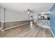 Open living room showcasing wood-look floors and neutral paint palette at 330 Pheasant Dr, Haines City, FL 33844