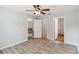 Neutral main bedroom with multiple doorways and wood look floors at 330 Pheasant Dr, Haines City, FL 33844