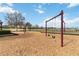 Community playground featuring swings and climbing bars over wood chips at 330 Pheasant Dr, Haines City, FL 33844