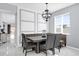 Dining area featuring marbled tile floors, modern table with booth seating, statement light fixture, and natural light at 3337 Reedy Glen Dr, Kissimmee, FL 34758