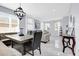 Inviting dining area with stylish bench seating, modern lighting, and easy access to the adjacent living space at 3337 Reedy Glen Dr, Kissimmee, FL 34758