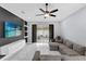 Cozy living room featuring a modern accent wall, sleek shelving, and seamless transition to the outdoor patio at 3337 Reedy Glen Dr, Kissimmee, FL 34758