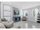 Bright living room featuring white marbled tile floors, modern furnishings, decorative wall accents, and natural light at 3337 Reedy Glen Dr, Kissimmee, FL 34758