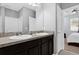 Ensuite bathroom with dual sinks and views into main bedroom at 3337 Reedy Glen Dr, Kissimmee, FL 34758