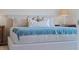 Serene bedroom with a plush bed and soft blue blanket at 3534 Fort Mellon Ln, Sanford, FL 32773