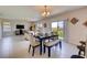 Dining area with a table and bench seating, looking out to a backyard at 3813 Royal Azalea Way, Sanford, FL 32773