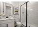 Modern bathroom with a glass-enclosed shower, marble-look tile, and contemporary vanity at 4104 Southern Vista Loop, St Cloud, FL 34772