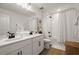 Bright bathroom featuring a double vanity, framed mirror, and modern fixtures at 4104 Southern Vista Loop, St Cloud, FL 34772