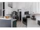 Bright kitchen with stainless steel appliances and white cabinetry provides a functional cooking space at 421 Boxwood Dr, Davenport, FL 33837