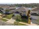 Two-story house with a lake view in a residential neighborhood at 4700 Golden Beach Ct, Kissimmee, FL 34746