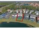 Aerial view showcasing a home with a pool and a lake view at 4700 Golden Beach Ct, Kissimmee, FL 34746