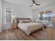 Comfortable main bedroom with wood-look floors and plenty of natural light at 4700 Golden Beach Ct, Kissimmee, FL 34746