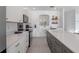 Modern kitchen with white cabinets and a large island at 4700 Golden Beach Ct, Kissimmee, FL 34746