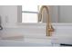 Modern kitchen with sleek gold faucet and white sink at 4700 Golden Beach Ct, Kissimmee, FL 34746