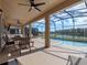 Screened-in pool and patio overlooking a lake at 4700 Golden Beach Ct, Kissimmee, FL 34746