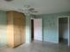 Bedroom with light wood wardrobe and green walls at 477 C St # 4, Casselberry, FL 32707