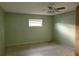 A bedroom with light green walls, ceiling fan, and tile flooring at 477 C St # 4, Casselberry, FL 32707