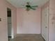 Dining area with pink walls and ceiling fan at 477 C St # 4, Casselberry, FL 32707