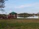 Lakeside gazebo with wooden picnic table and chairs at 477 C St # 4, Casselberry, FL 32707