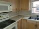 Kitchen with light wood cabinets and appliances at 477 C St # 4, Casselberry, FL 32707