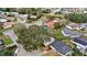 Aerial neighborhood shot featuring mature trees and various roof types at 4817 Gallant Ln, Orlando, FL 32821