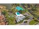 An aerial view shows community pool, tennis, shuffleboard, and clubhouse surrounded by trees and green spaces at 4817 Gallant Ln, Orlando, FL 32821