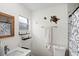 Neat bathroom featuring a sink, toilet, and a window providing natural light, decorated with turtle art at 4817 Gallant Ln, Orlando, FL 32821