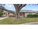 Inviting single-story home featuring a covered entrance, brick-paved drive, and lush green lawn at 4817 Gallant Ln, Orlando, FL 32821