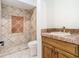 Bathroom with terracotta tile and wood vanity at 5067 Latrobe Dr, Windermere, FL 34786