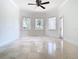 Spacious bedroom with bay windows and travertine flooring at 5067 Latrobe Dr, Windermere, FL 34786