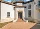 Elegant entryway with double doors and curved staircase at 5067 Latrobe Dr, Windermere, FL 34786