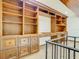 Custom built-in wooden shelving and cabinetry with ample storage space at 5067 Latrobe Dr, Windermere, FL 34786