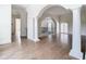 Open floor plan with hardwood floors and arched doorways at 5067 Latrobe Dr, Windermere, FL 34786