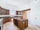 Island kitchen with granite countertops and wood cabinets at 5067 Latrobe Dr, Windermere, FL 34786