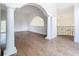 Bright room with hardwood floors and arched hallway at 5067 Latrobe Dr, Windermere, FL 34786